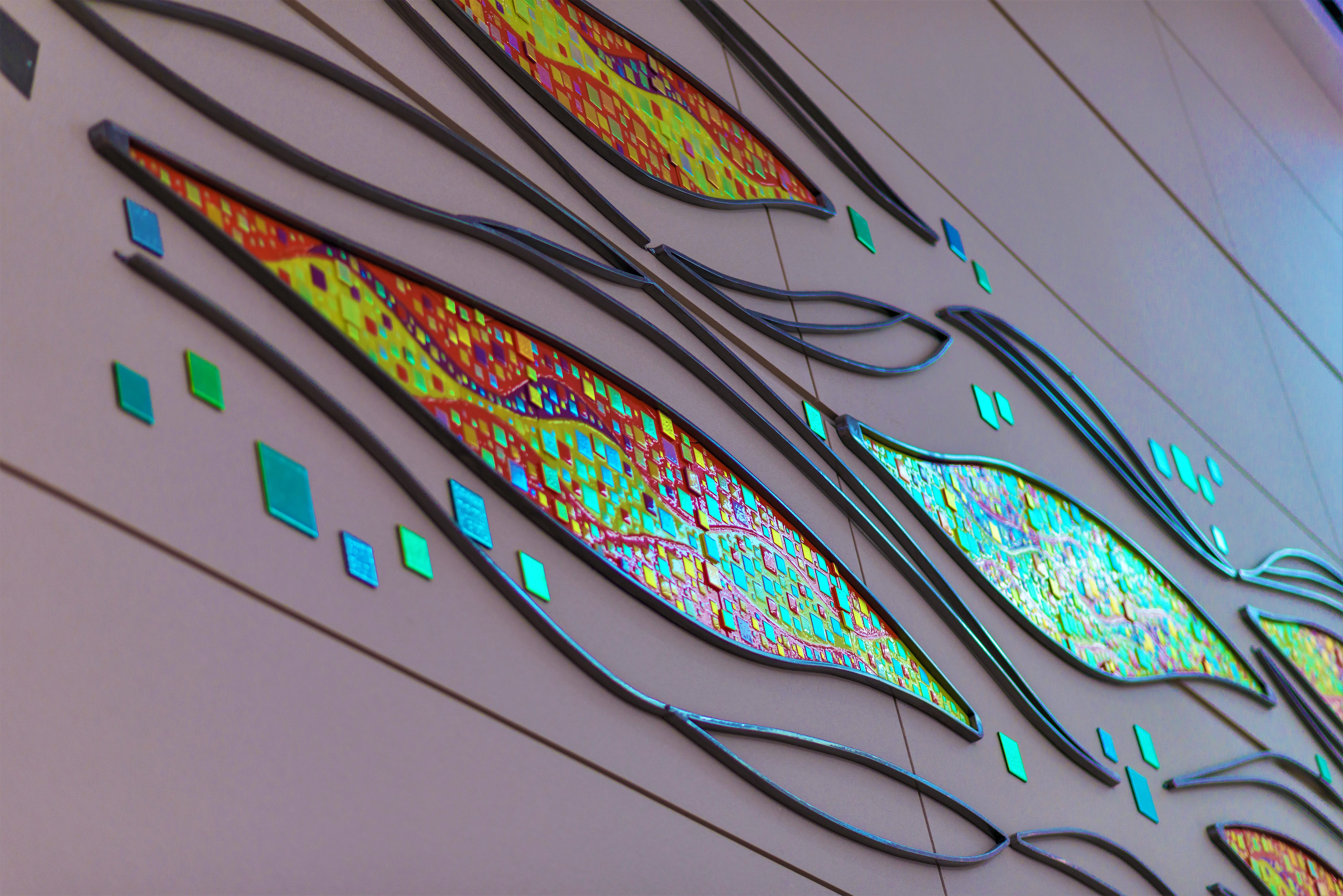 "Sunset Mirage" 90'x 19.5' metal and glass wall sculpture  close up